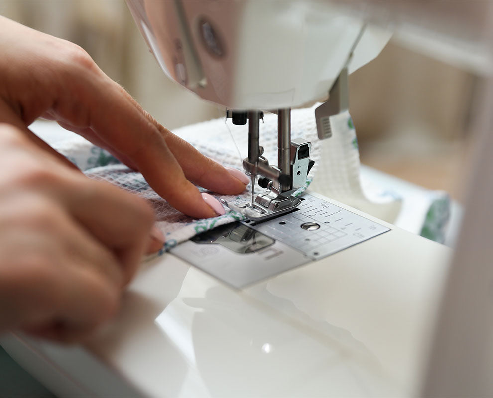 sewing machine sewing patterns on fabric